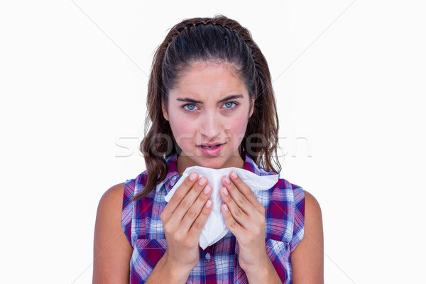 Pretty brunette woman blowing her nose  Stock photo © wavebreak_media