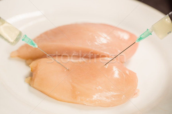 Food scientist injecting raw chicken Stock photo © wavebreak_media