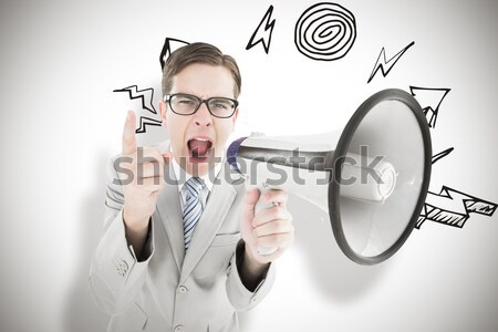 Composite image of geeky businessman shouting through megaphone Stock photo © wavebreak_media