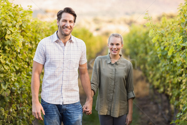 Two young happy vintners holding hands Stock photo © wavebreak_media