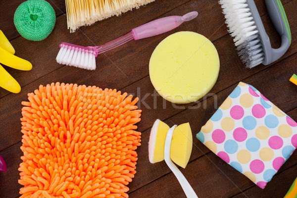 Various cleaning equipment arranged on wooden floor Stock photo © wavebreak_media