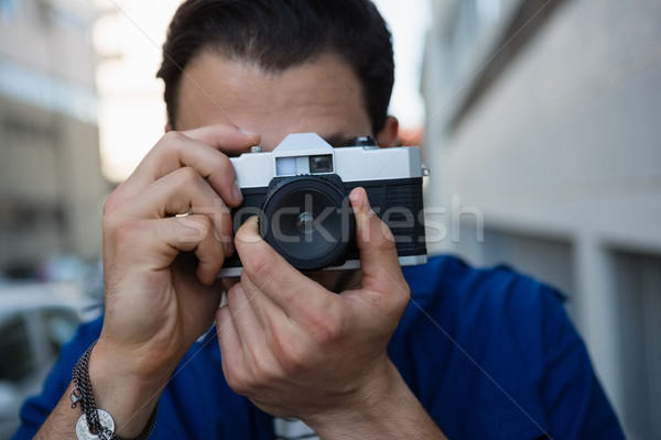 Man photographing with camera Stock photo © wavebreak_media