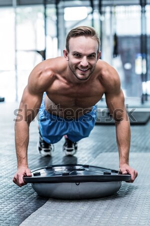 Athletic man smiling to camera Stock photo © wavebreak_media