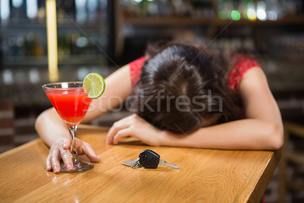 Drunk woman driver leaning on counter with her cocktail Stock photo © wavebreak_media