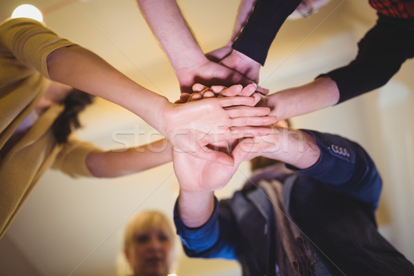 Creative business people stacking hands in office Stock photo © wavebreak_media