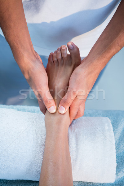 Physiotherapist giving foot massage to a woman Stock photo © wavebreak_media