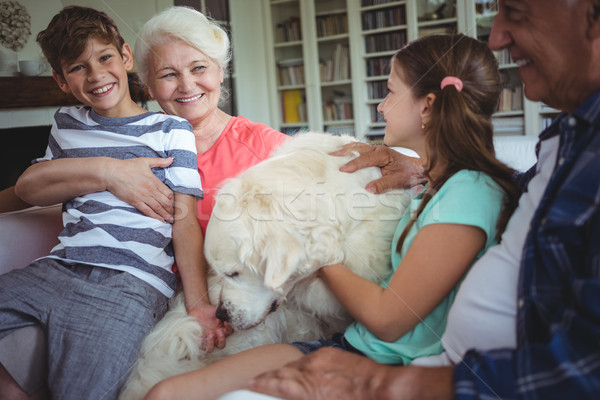 Grands-parents petits enfants séance canapé animal chien [[stock_photo]] © wavebreak_media