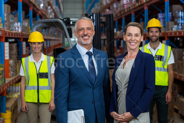 Portrait of warehouse manager standing with client Stock photo © wavebreak_media