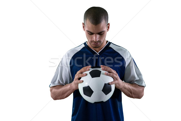 Football player holding football with both hands Stock photo © wavebreak_media