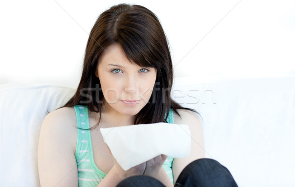 Portrait of a sick young woman blowing  Stock photo © wavebreak_media