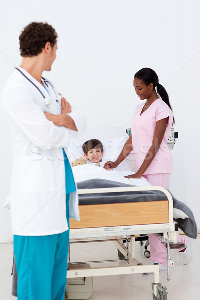 Pediatrician and nurse attending to a child in the hospital Stock photo © wavebreak_media
