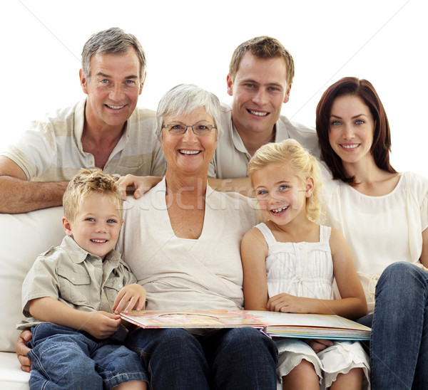 Smiling family observing photograph album Stock photo © wavebreak_media