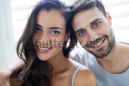 Portrait affectueux couple séance lit jeunes [[stock_photo]] © wavebreak_media