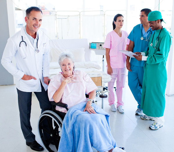 Positive medical team taking care of a senior woman at hospital Stock photo © wavebreak_media