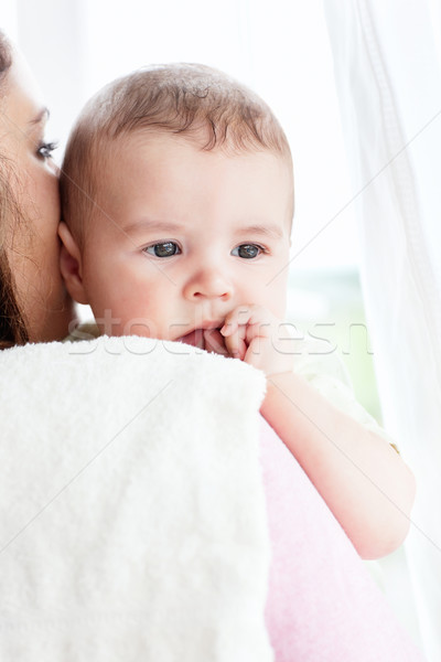 Kind caucasian mother taking care of her adorable baby at home Stock photo © wavebreak_media