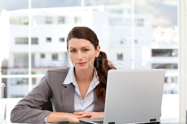 Businesswoman on the computer looking at the camera in an office Stock photo © wavebreak_media