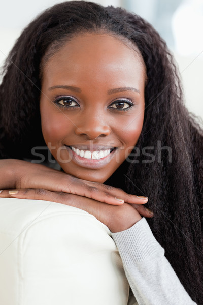 Close up of smiling young woman lying on the sofa Stock photo © wavebreak_media
