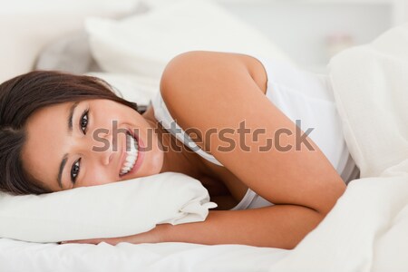 Woman lying on her back in her bedroom Stock photo © wavebreak_media