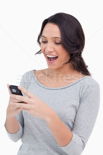 Közelkép boldog nő olvas szöveges üzenet fehér Stock fotó © wavebreak_media