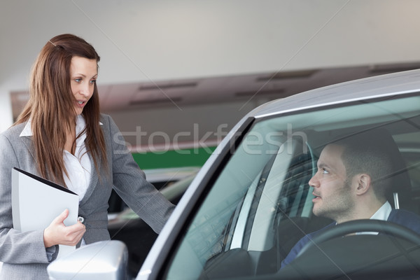 Woman speaking to a man in a garage Stock photo © wavebreak_media