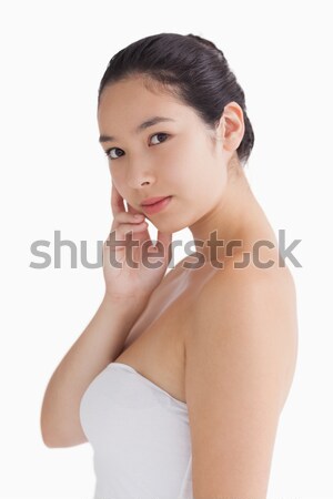 Woman holding her chin while looking natural Stock photo © wavebreak_media