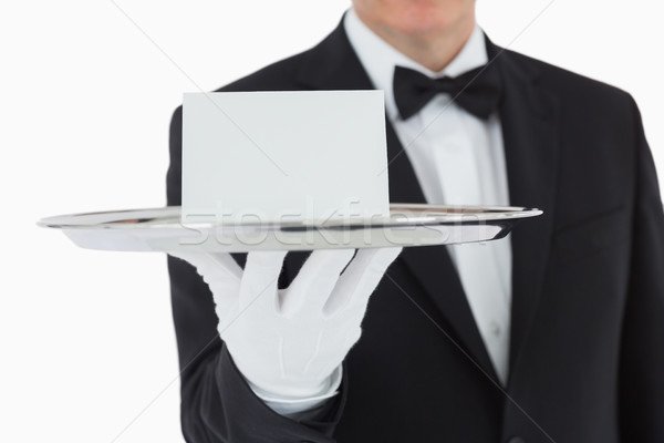 Man holding silver tray with white blank card Stock photo © wavebreak_media