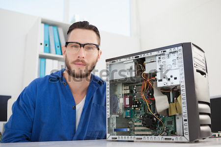 Man typing on laptop while doing server maintenance Stock photo © wavebreak_media