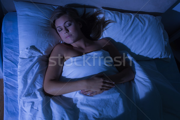 Hight angle view of cute woman sleeping Stock photo © wavebreak_media