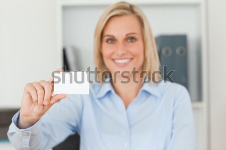 Female executive holding blank card at office Stock photo © wavebreak_media