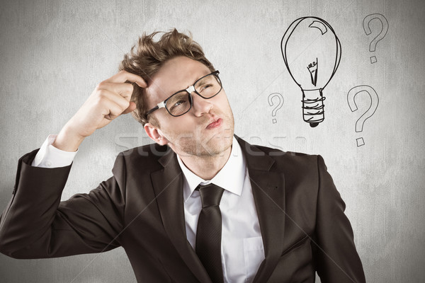 Composite image of young geeky businessman scratching his head Stock photo © wavebreak_media