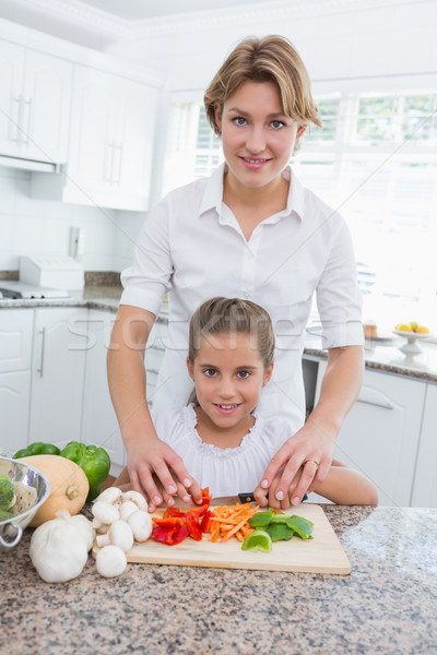 Mother and daughter preparing vegetables Stock photo © wavebreak_media