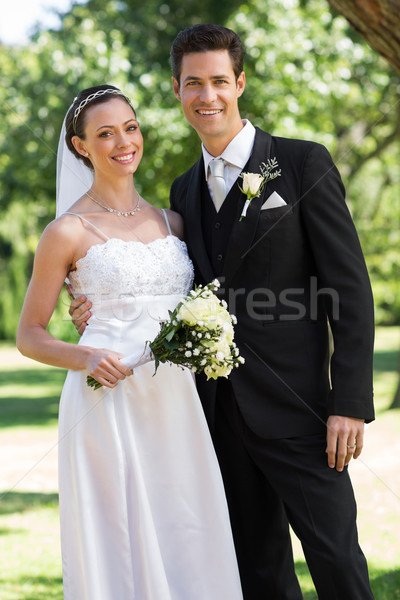 Newly wed couple standing in garden Stock photo © wavebreak_media