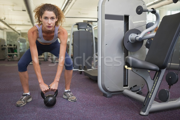 Fit woman squatting with kettlebell  Stock photo © wavebreak_media