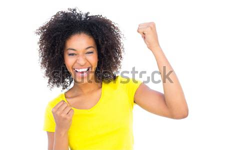 Pretty girl in yellow tshirt holding brazilian flag cheering at  Stock photo © wavebreak_media