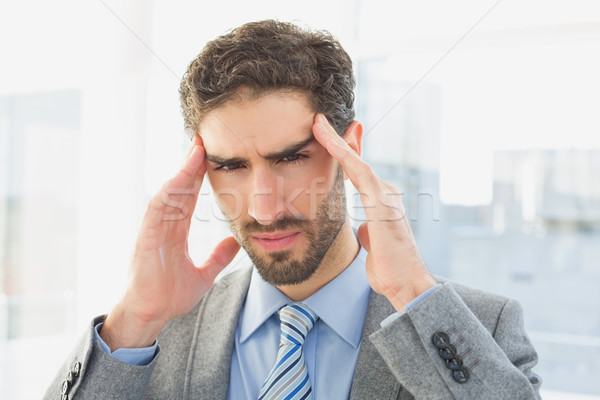 Stock photo: Businessman suffering from a headache