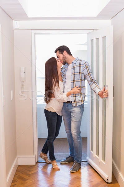 Cute couple walking through the door Stock photo © wavebreak_media