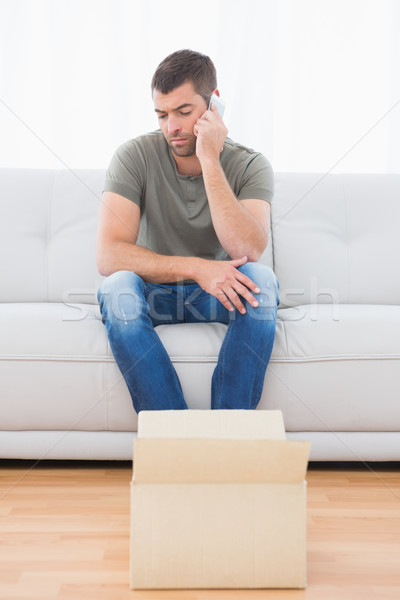 Casual man sitting in a sofa Stock photo © wavebreak_media