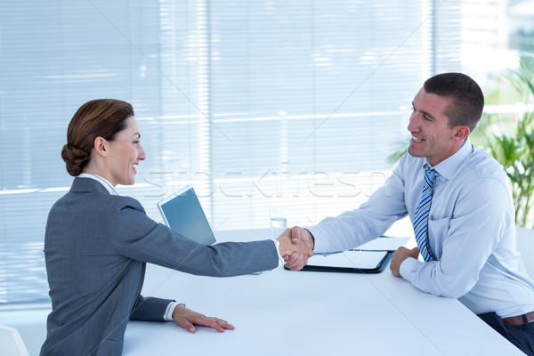 Business partners shaking hand together Stock photo © wavebreak_media