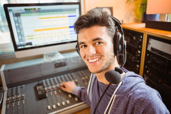 Stock photo: Portrait of an university student mixing audio