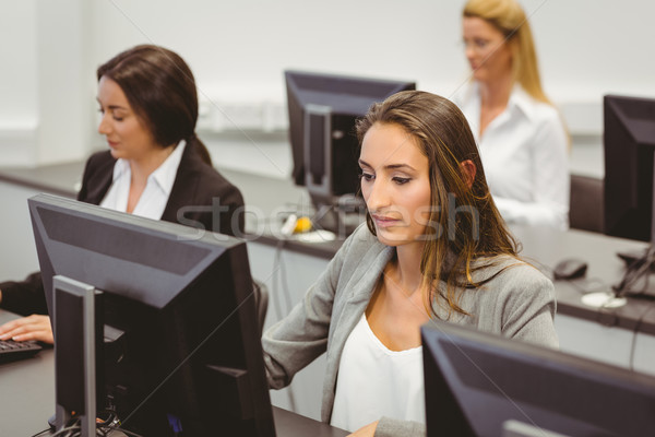 Focused businesswomen working in computer room Stock photo © wavebreak_media