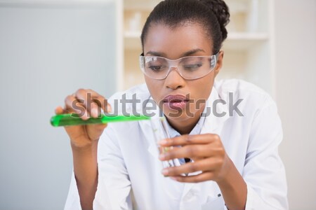 Concentrated scientist doing scientific experiment Stock photo © wavebreak_media