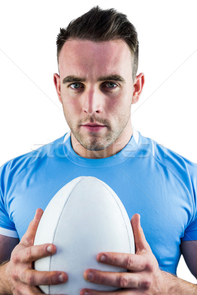 Stock photo: Rugby player looking at camera with ball