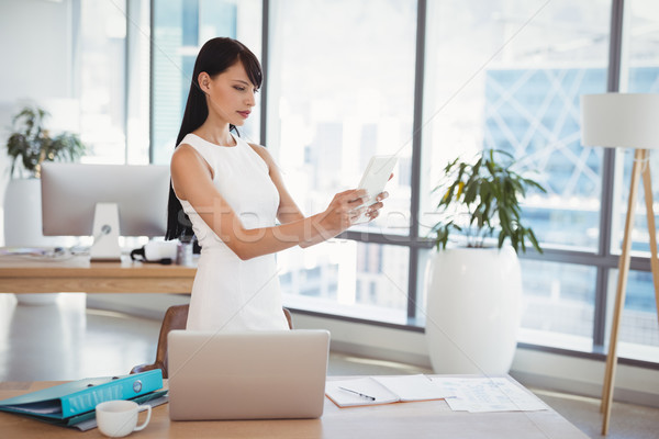 Attentive executive using digital tablet at desk Stock photo © wavebreak_media