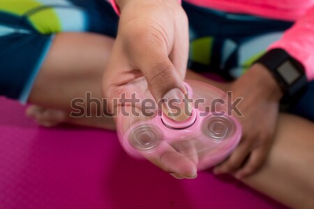 Girl playing with fidget spinner  Stock photo © wavebreak_media