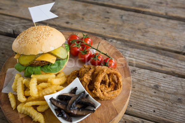 Stock photo: High angle view of ingredients with burger on cutting board