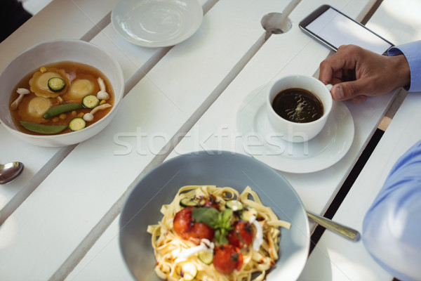 Człowiek kubek herbaty śniadanie tabeli restauracji Zdjęcia stock © wavebreak_media