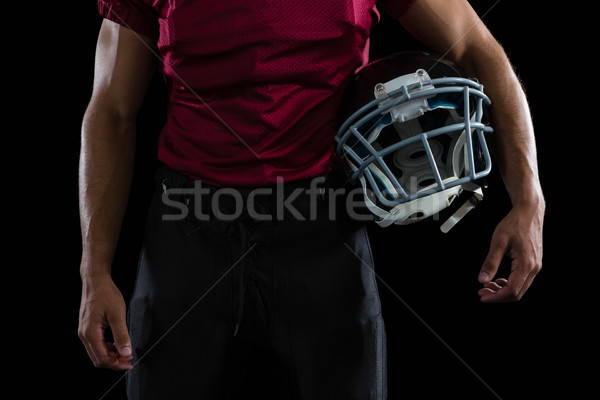 American football player holding a head gear  Stock photo © wavebreak_media