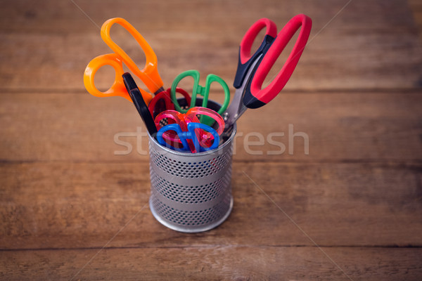 Stock photo: Close up of scissors in desk organizer on wooden table