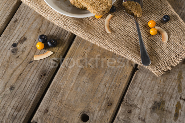 Granola bar and berry fruit on wooden table Stock photo © wavebreak_media