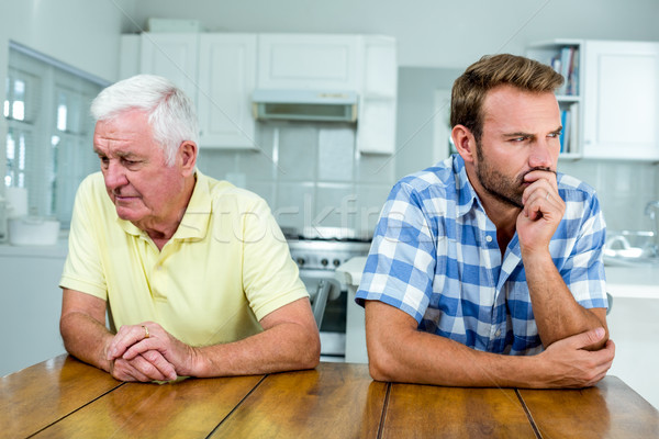 Père en fils séance table cuisine famille [[stock_photo]] © wavebreak_media